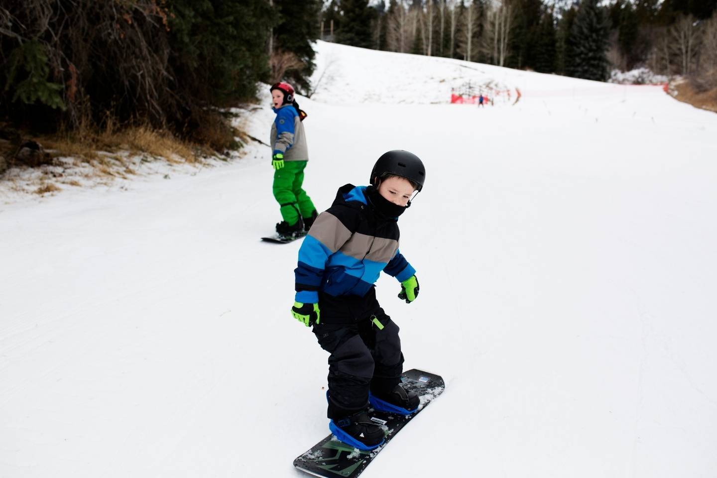 Kids snowboarding