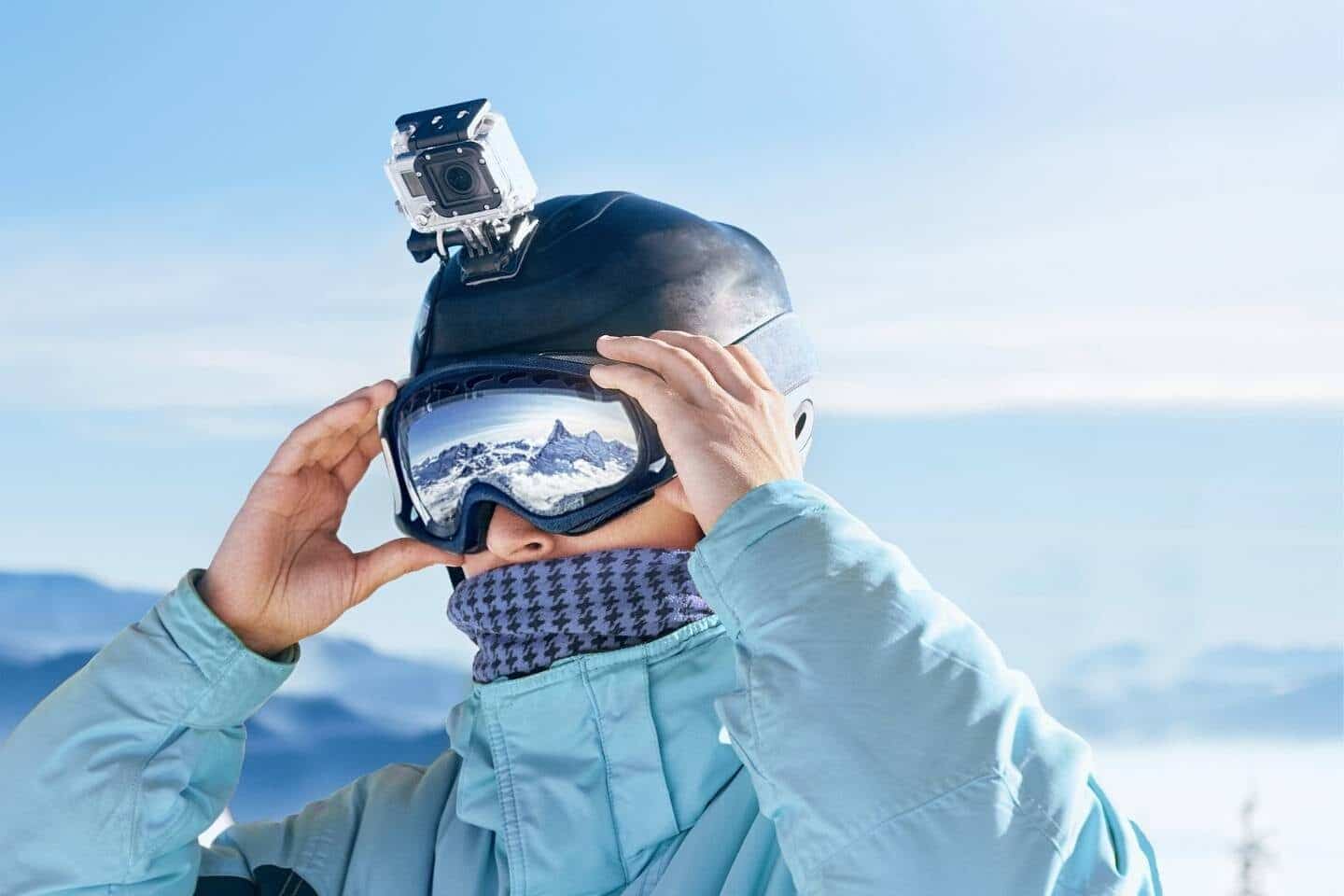 Skier with action camera on a helmet