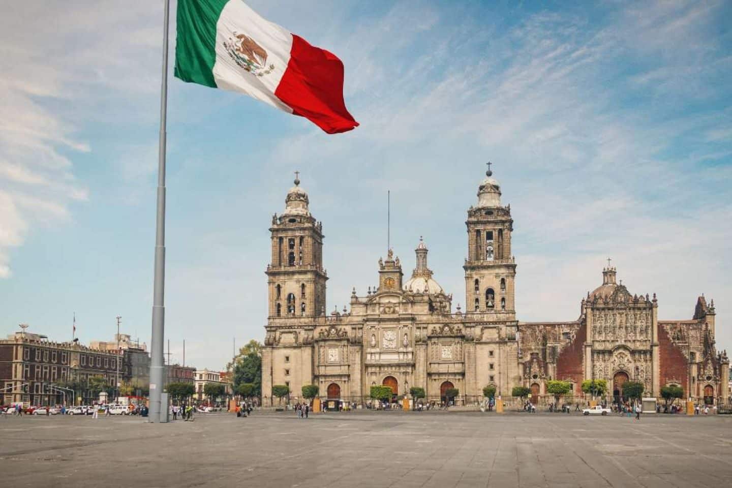 An image of Mexico City with flag pole.