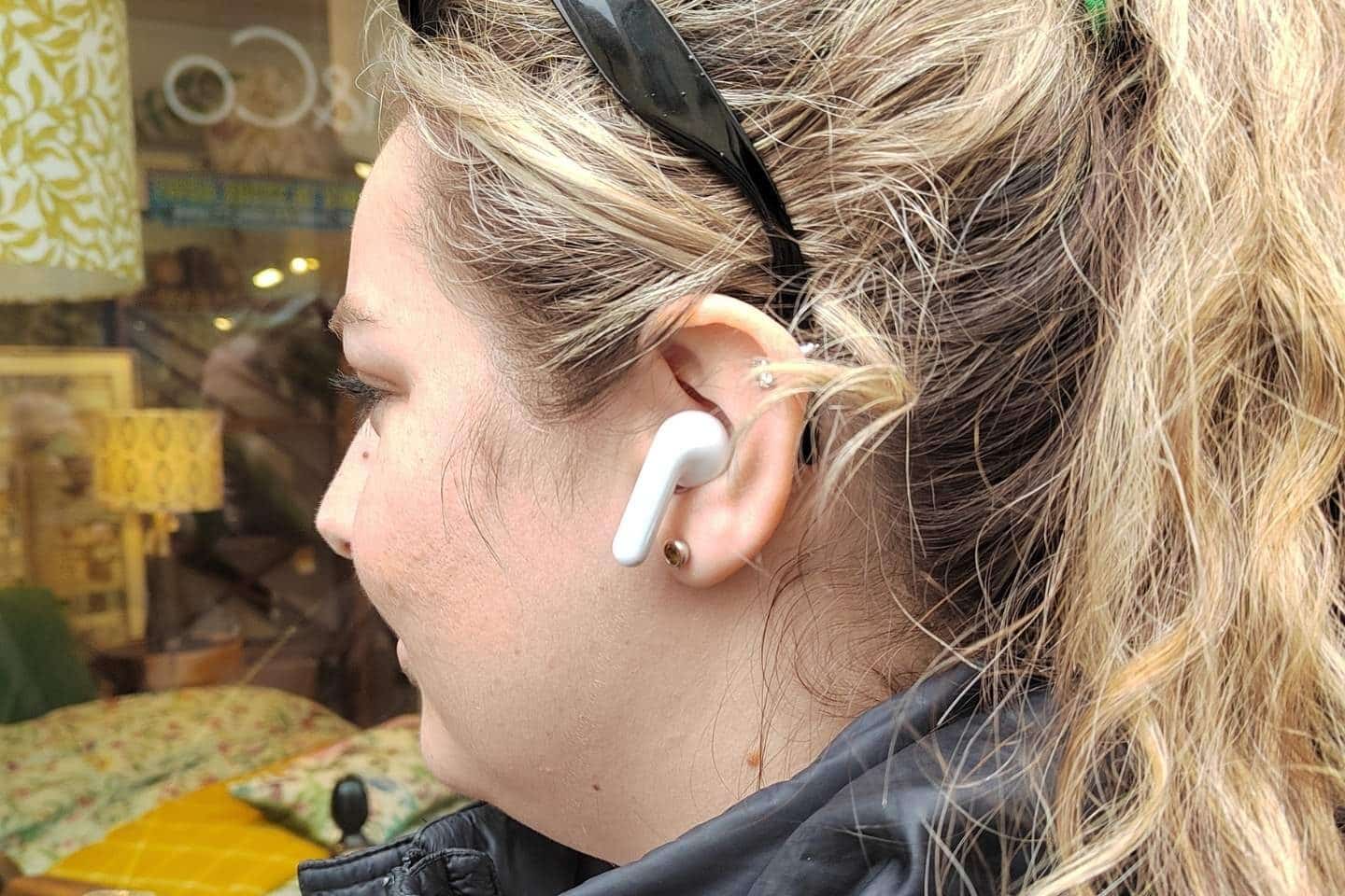 Woman using a Timekettle M3 Earbuds