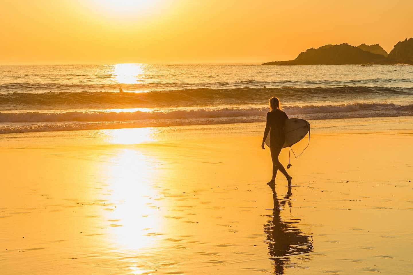 surfing at sunset in portugal