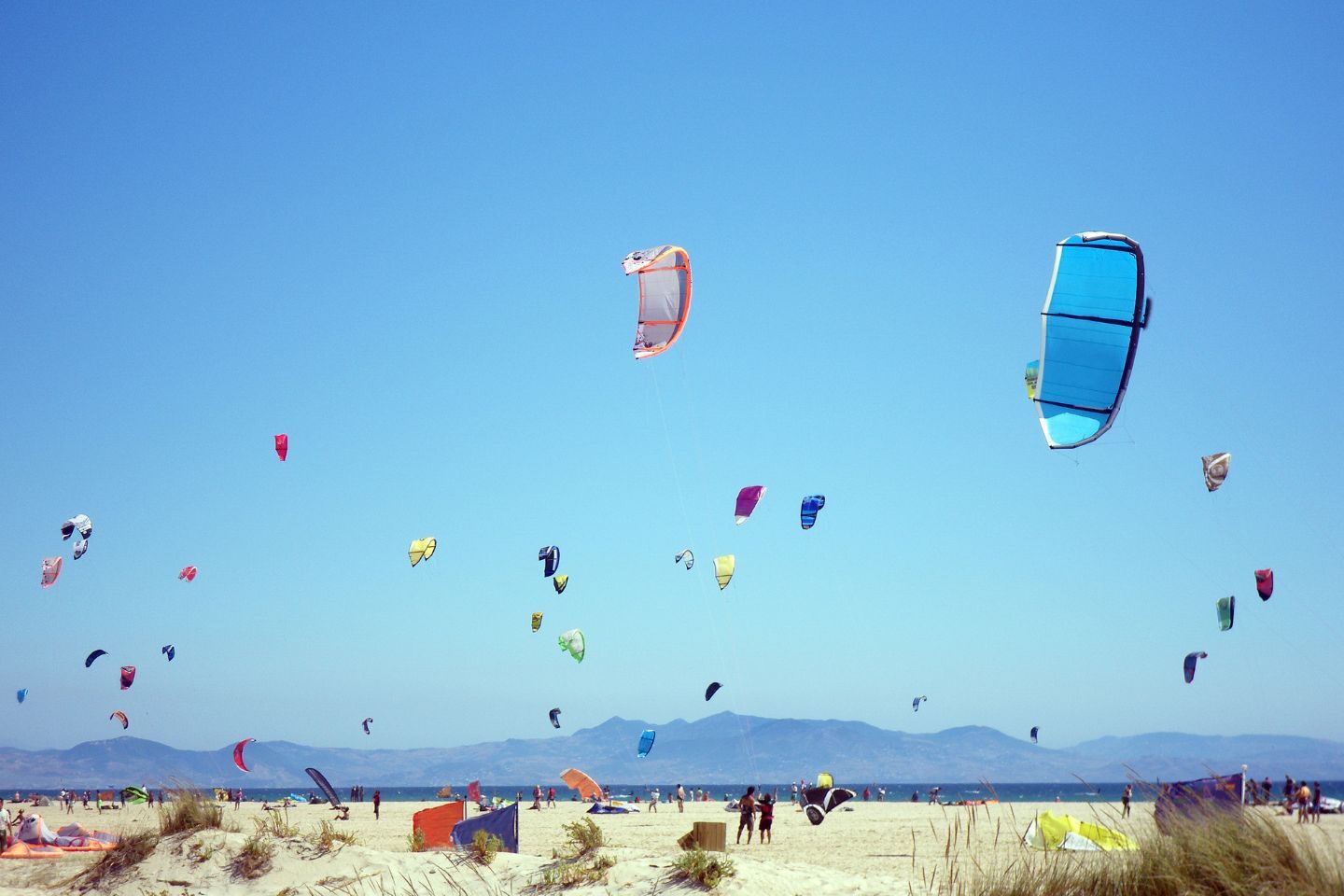 Colourful kites at a kitesurfing camp in Tarifa, Spain