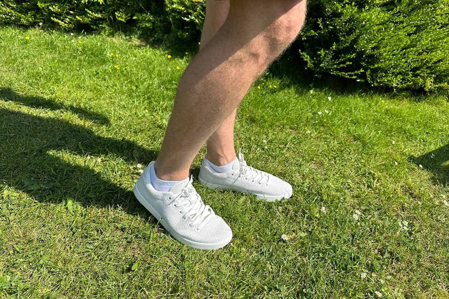 Tom in Allbirds Tree Pipers walking on the grass