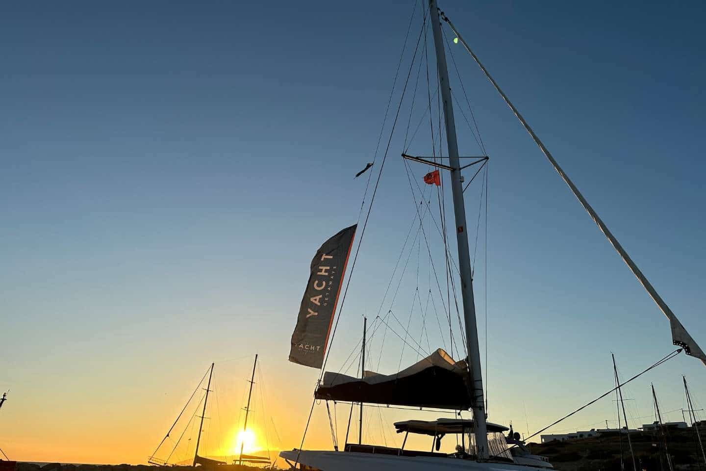 yacht sailing at sunset