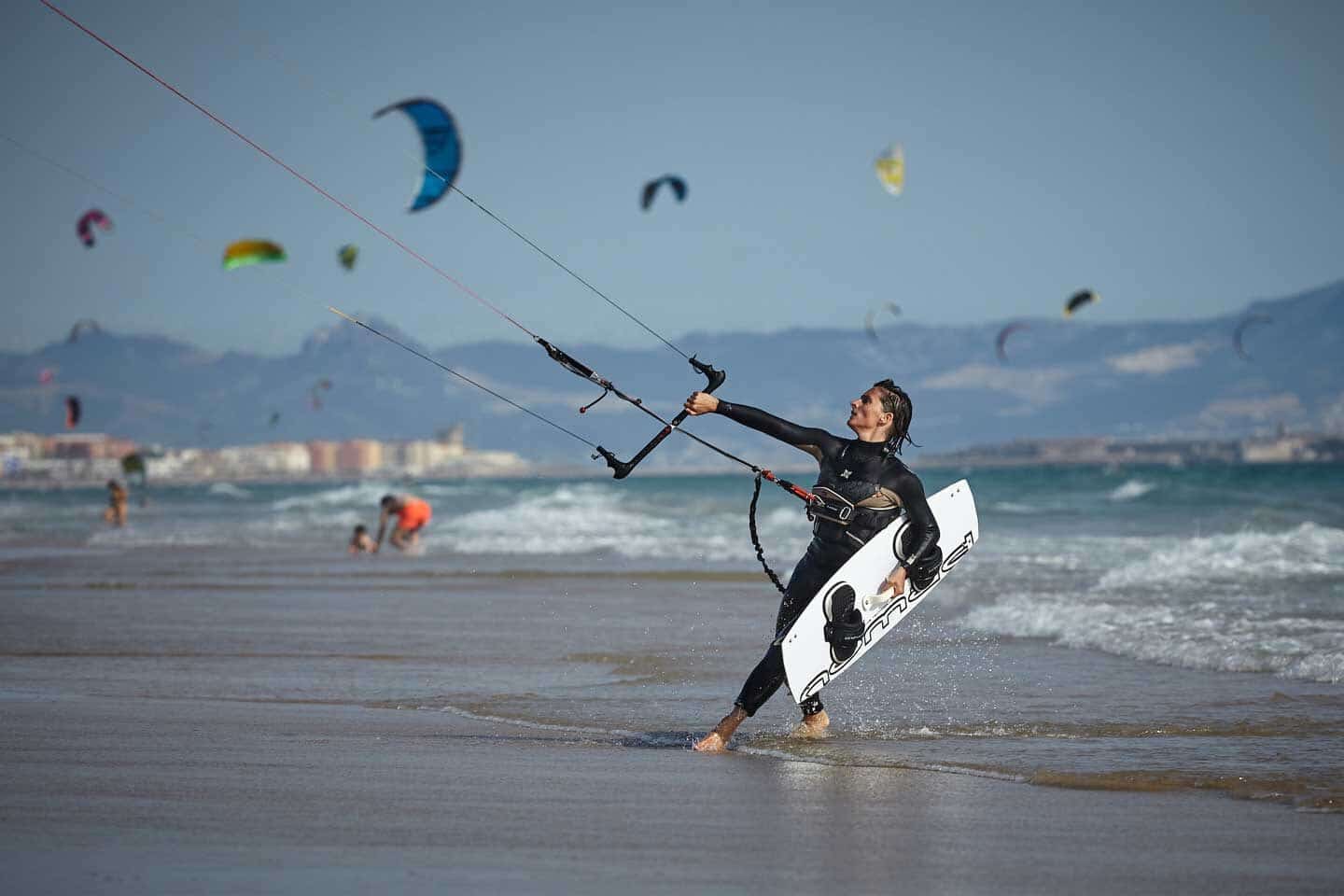 An active surfer kitesurfing in Tarifa, Spain