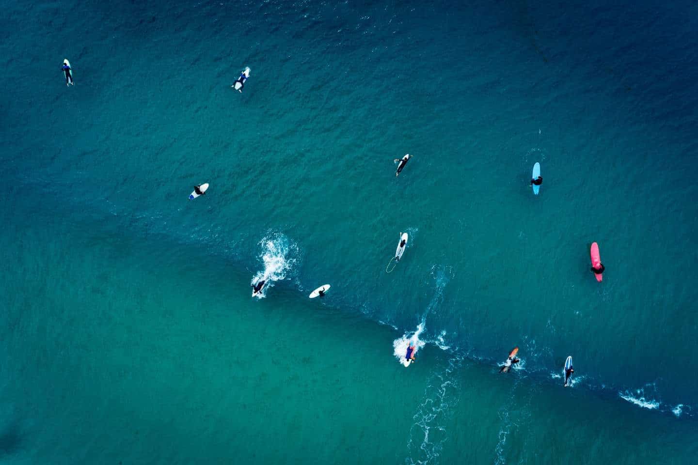A group of people surfing in Baleal, Portugal