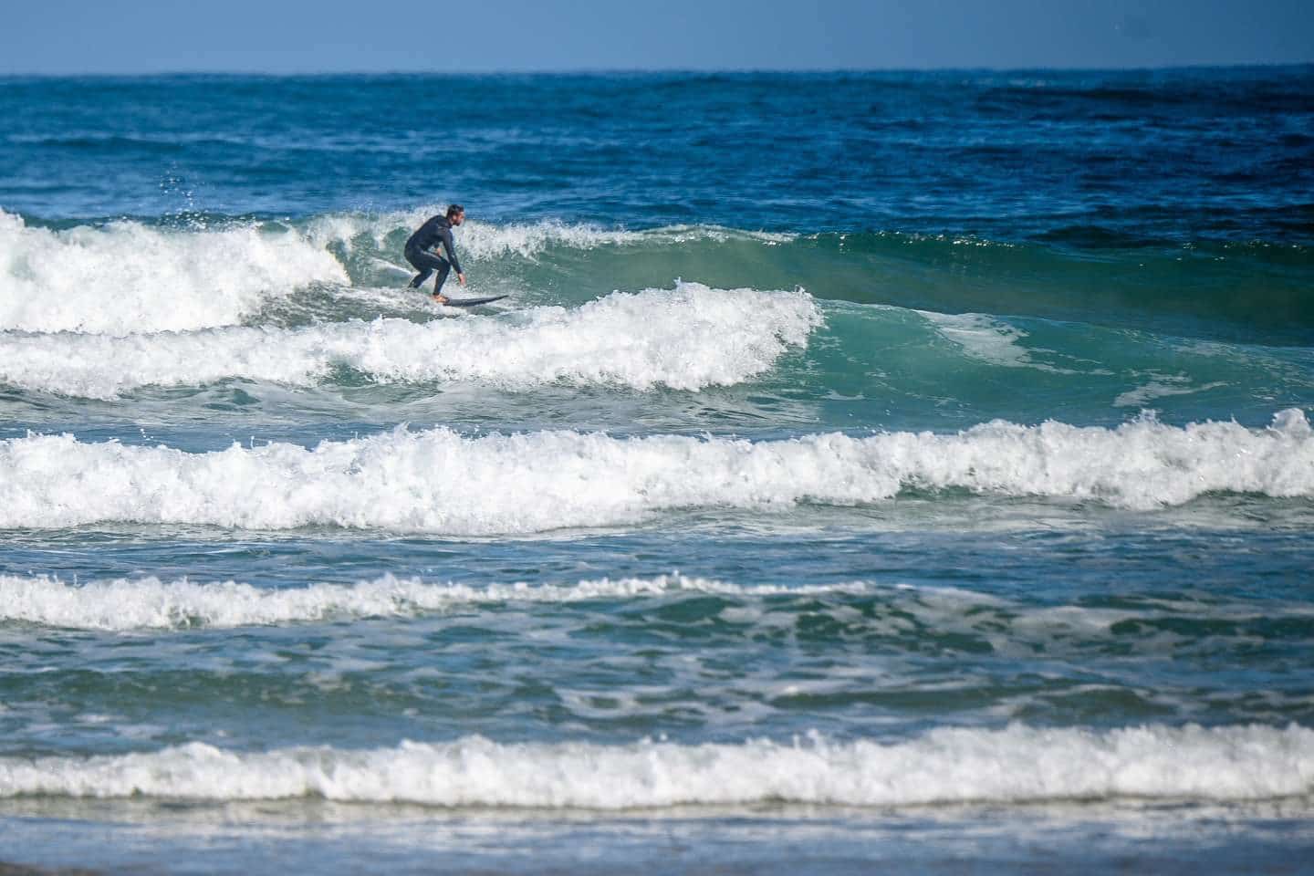 A surfer on the waves in Portugal
