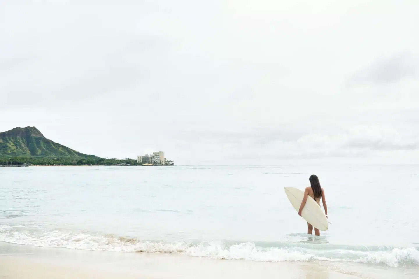 a-woman-surfing-in-hawaii