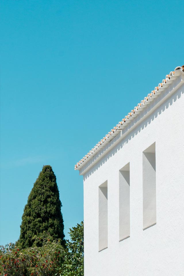 Blue-skies, white buildings and trees