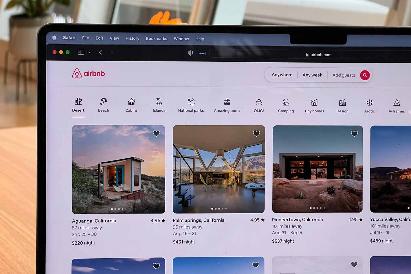The Airbnb website open on a laptop