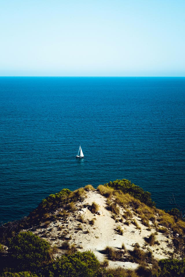 Views of a boat sailing along the ocean